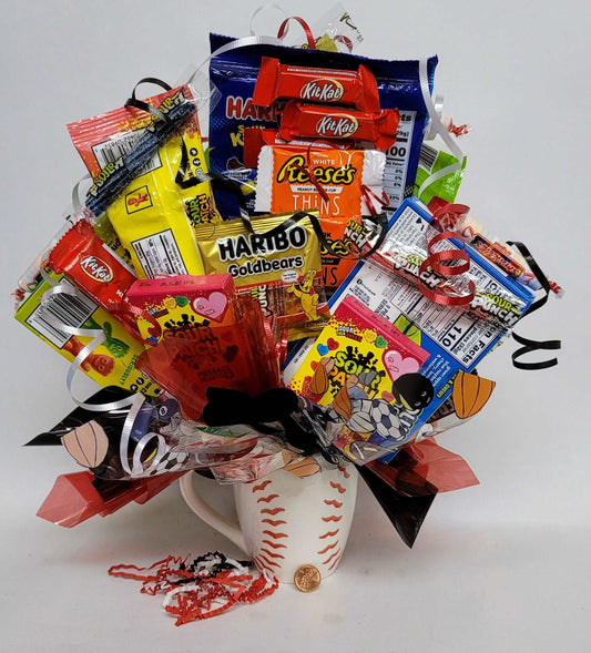 Assortment of candies arranged as a bouquet in a Baseball ceramic mug with colorful ribbons and decorations.